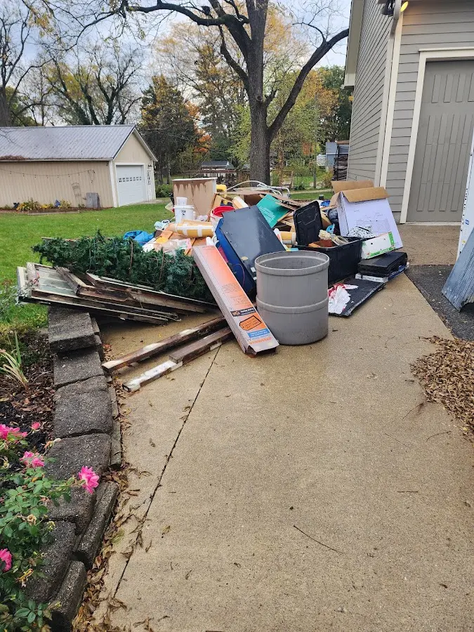 Dumpster being loaded with debris for 10 Yard Dumpster Rental in Anaheim